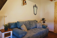 türkises Zimmer mit Sofa (Schlafoption für max. zwei Erwachsene)